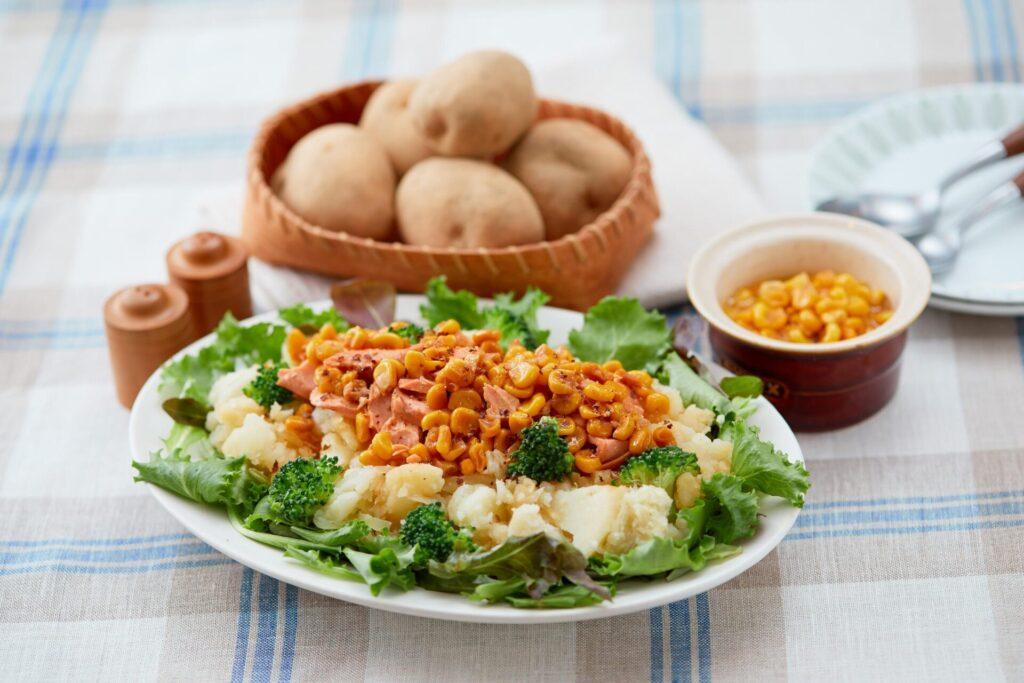 Potato Salad Topped with Salmon and Corn in Butter Soy Sauce